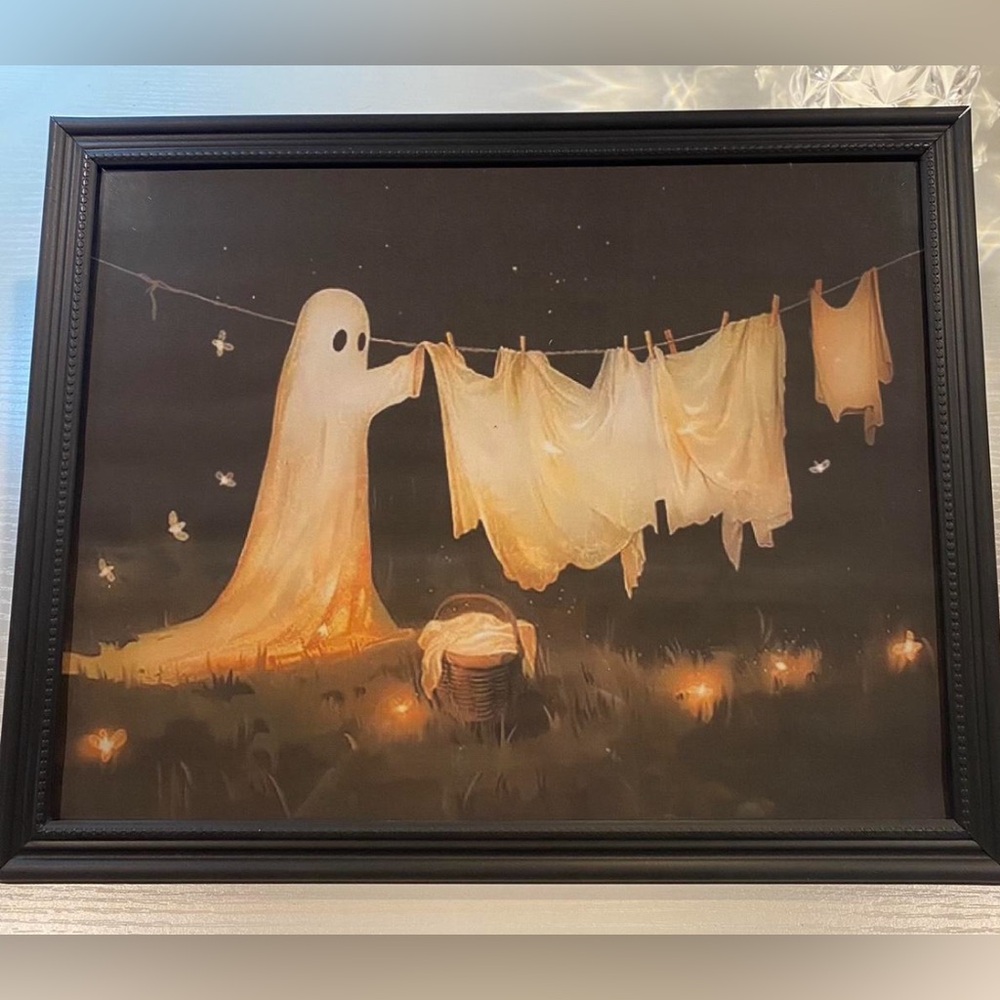 Spooky ghost and clothes hanging on a clothesline, framed 8x10”